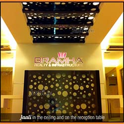 Black acrylic Jaalis in the ceiling and on the reception table copy